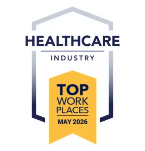 TWP-I_Healthcare_May_2026 Award badge: Healthcare Industry Top Workplaces May 2026, featuring a yellow ribbon/banner with dark blue text and a blue framed arch motif.