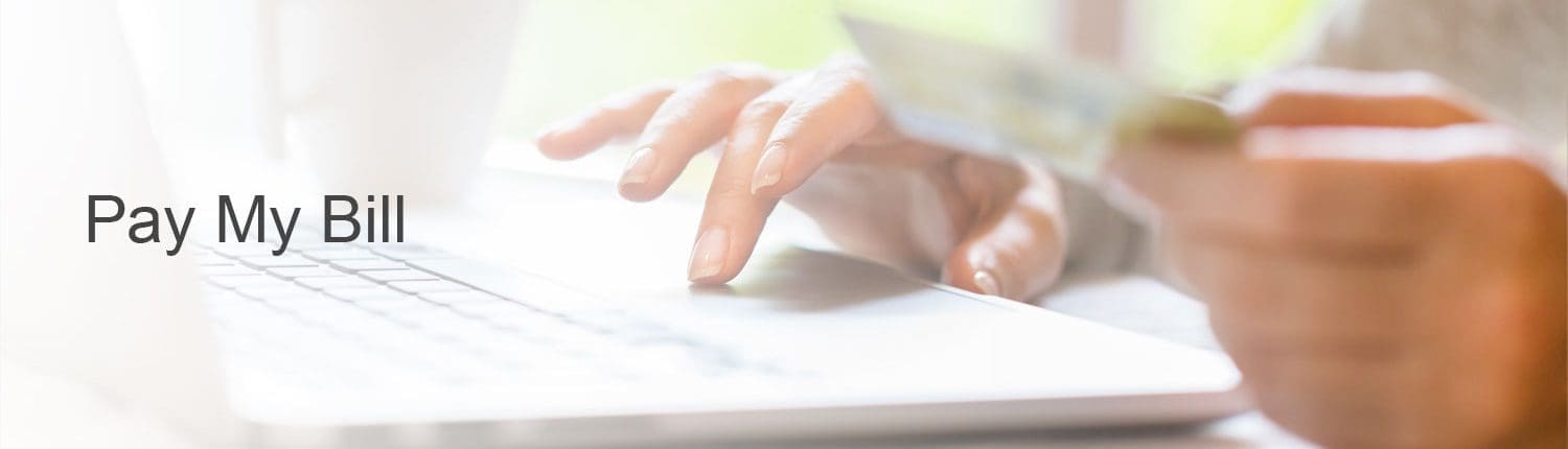 Woman using laptop to pay bill online