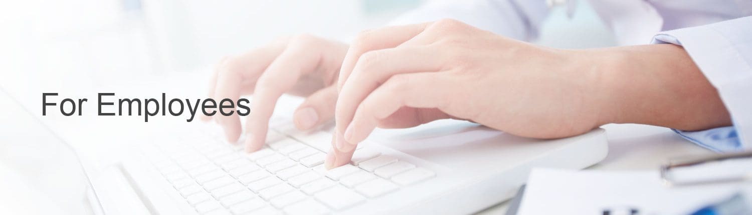 Hospital employee using laptop to log time