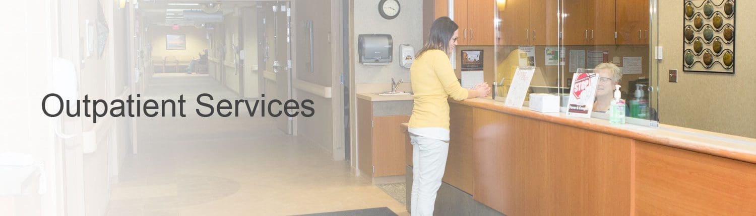 Woman standing at Health Center main desk in lobby